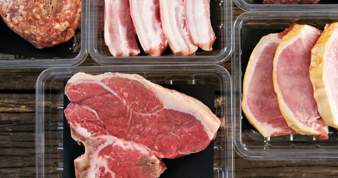 Assorted Raw Meat Cuts on Wooden Table - Free Images, Stock Photos and Pictures on Pikwizard.com