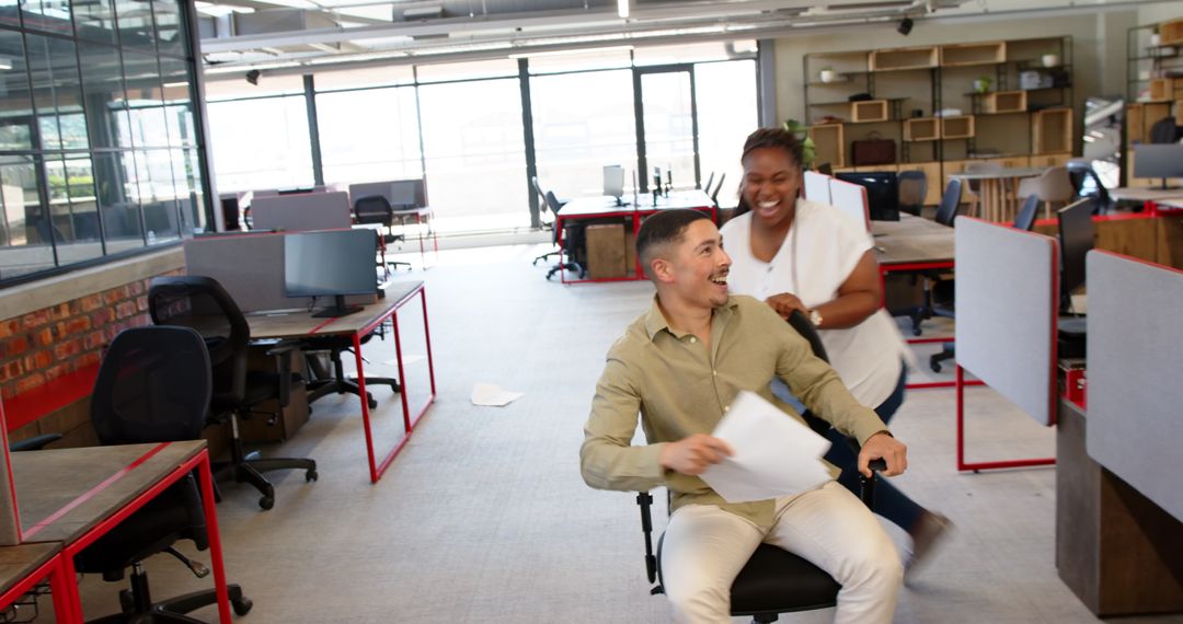 Diverse Colleagues Having Fun in Open Office Mavericks Style