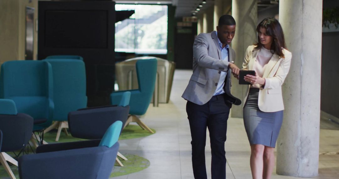 Professional Meeting in Modern Office Corridor