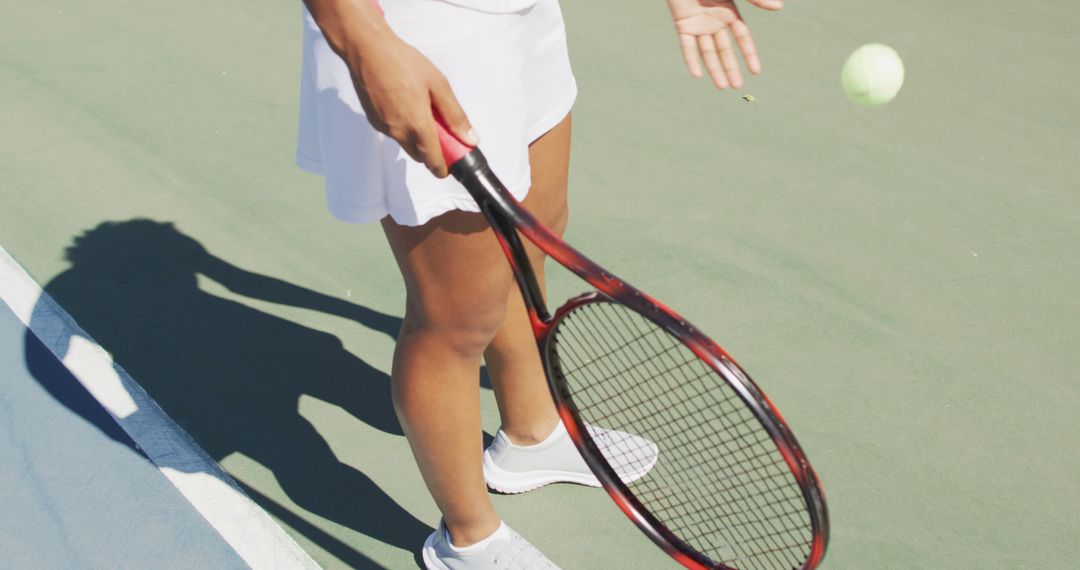 Female Tennis Player in White Outfit Preparing to Serve on Court - Free Images, Stock Photos and Pictures on Pikwizard.com