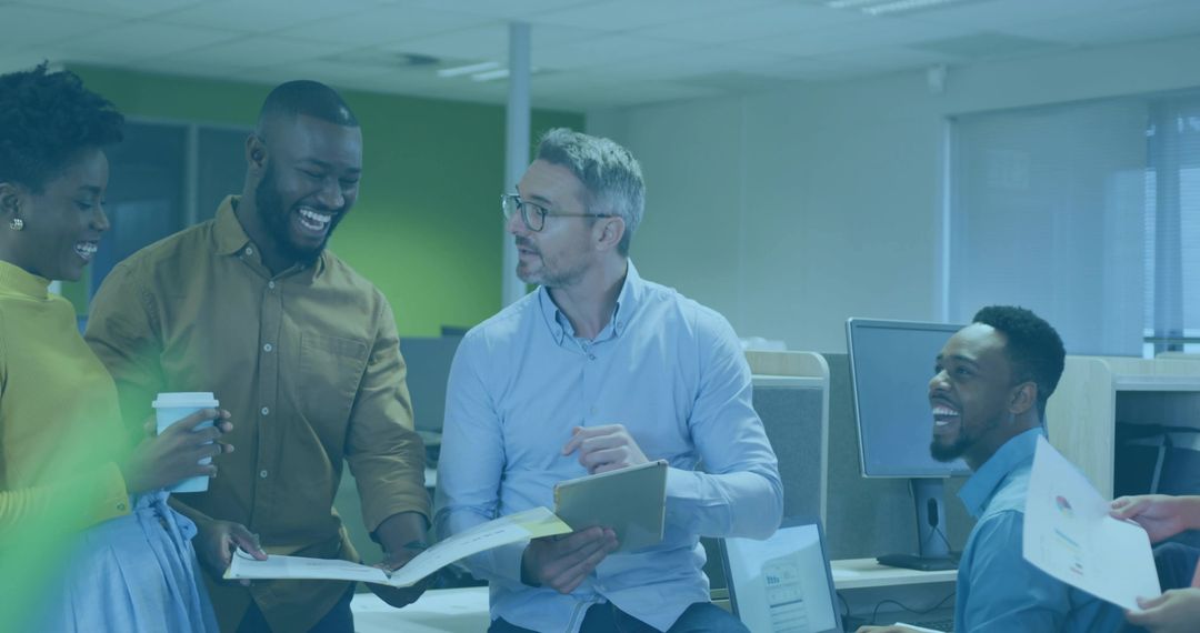 Coworkers Collaborating in Modern Office with Documents and Tablet