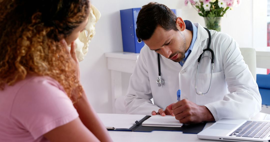 Doctor Consulting Female Patient in Medical Office - Free Images, Stock Photos and Pictures on Pikwizard.com