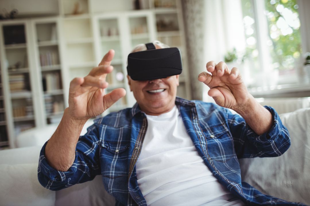 Senior Man Enjoying Virtual Reality at Home - Free Images, Stock Photos and Pictures on Pikwizard.com