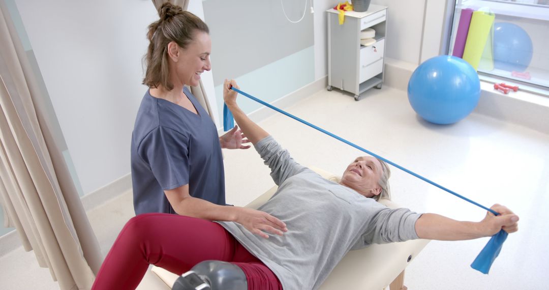 Physical Therapist Helping Senior Woman with Resistance Band Exercises - Free Images, Stock Photos and Pictures on Pikwizard.com