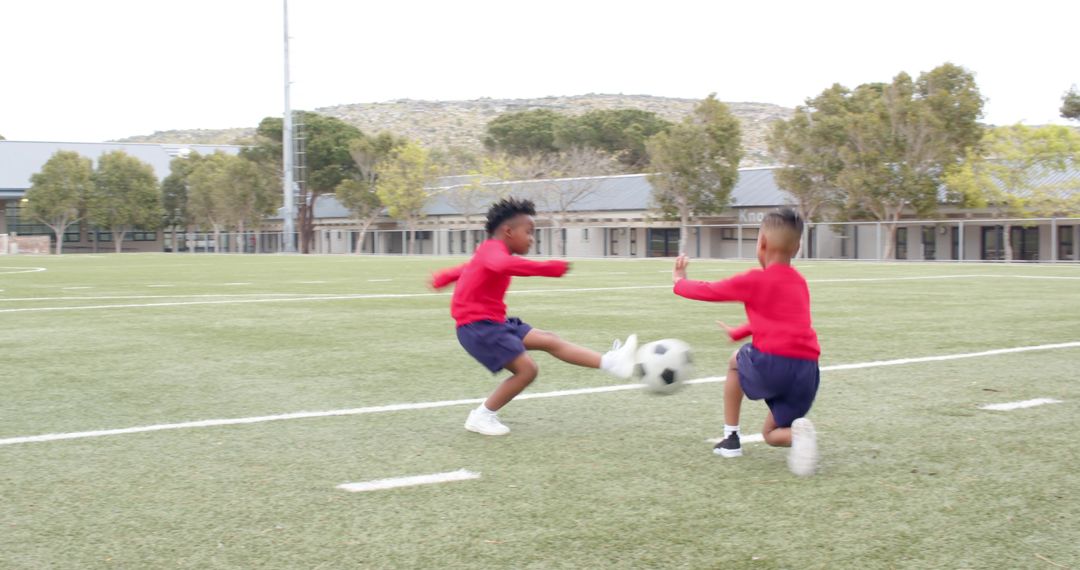 School-Aged Kids Engaging in Energetic Soccer Game on School Turf