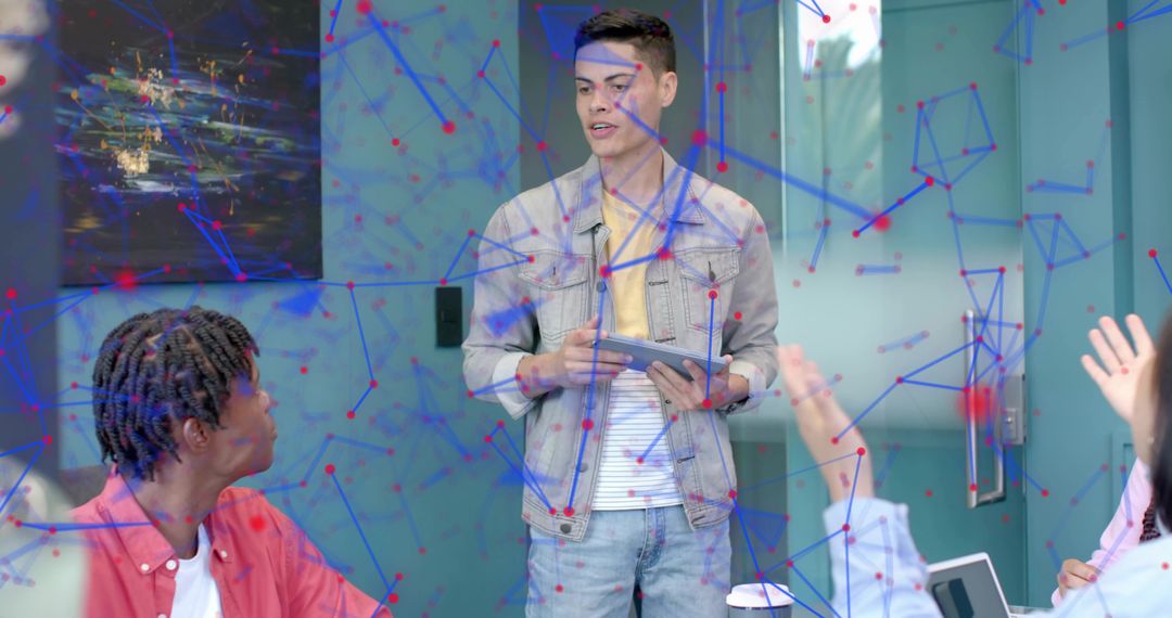 Young professional presenting with tablet in modern meeting room with data network overlay