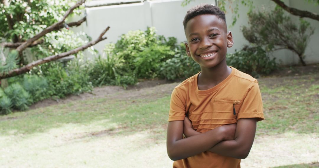 Smiling Boy Enjoying Sunny Day in Garden