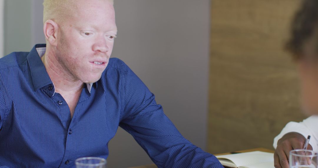 Diverse Business Team Discussing Creative Endeavors in Office