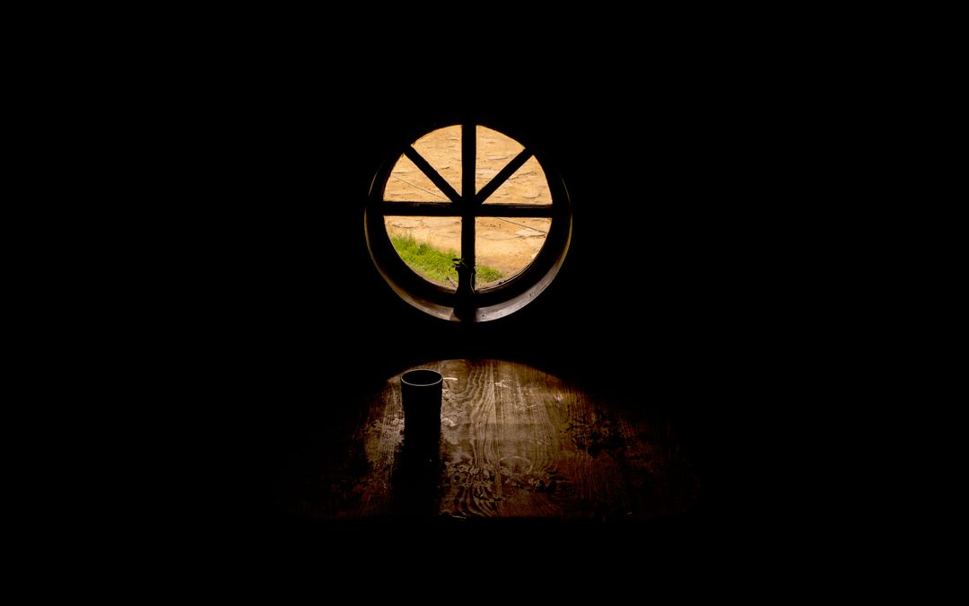 Round Window Contrast in Low Light Interior Setting