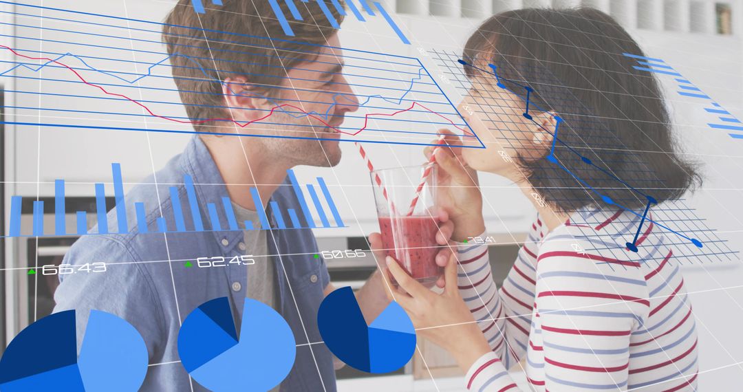 Romantic couple sharing smoothie in kitchen with business data charts overlay