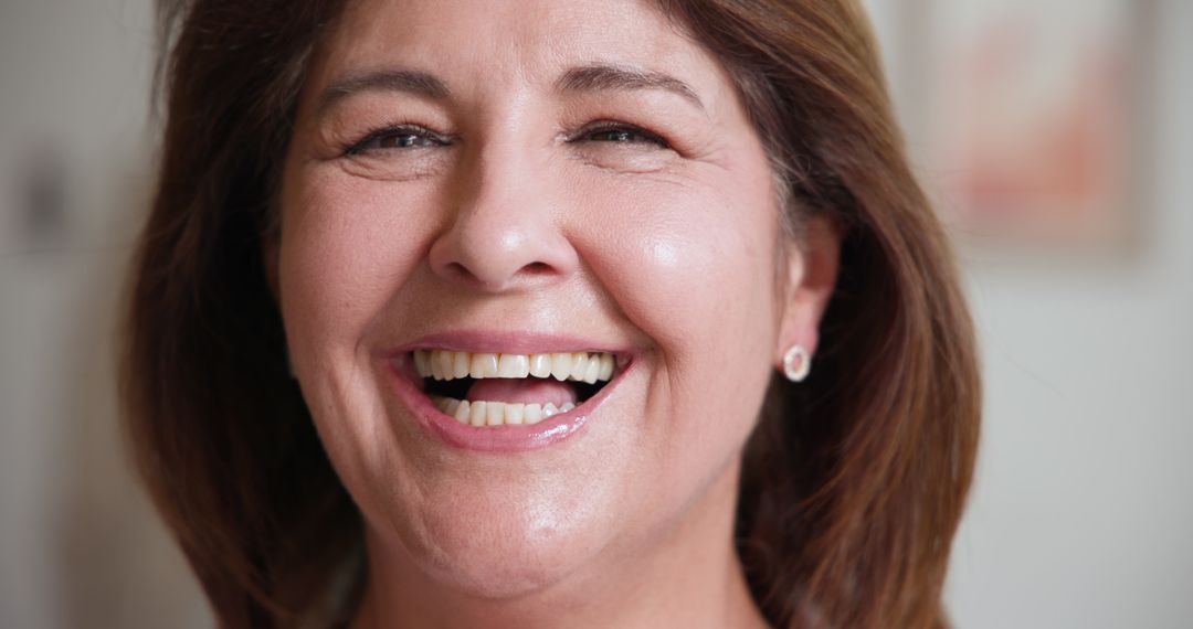 Senior Woman Smiling with Joy and Sophistication in Studio Portrait