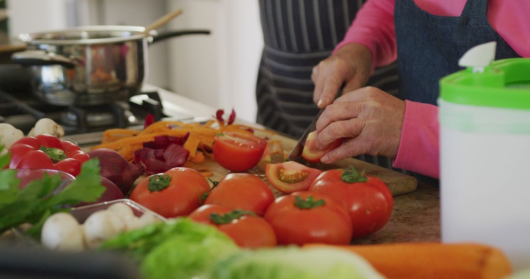 Senior Woman Preparing Fresh Vegetables in Home Kitchen - Free Images, Stock Photos and Pictures on Pikwizard.com