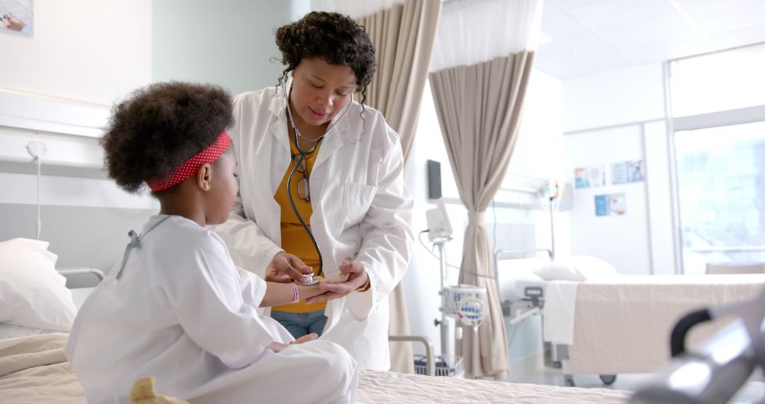 Pediatrician Examining Child Patient in Hospital Room - Free Images, Stock Photos and Pictures on Pikwizard.com