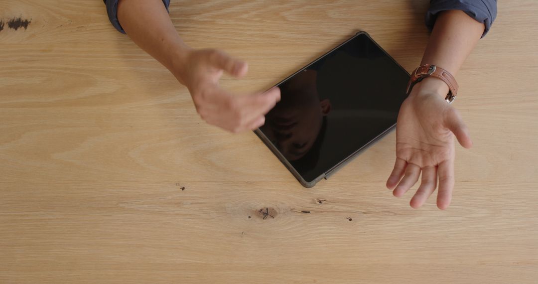 Business Professional Engaging in Meeting Near Tablet