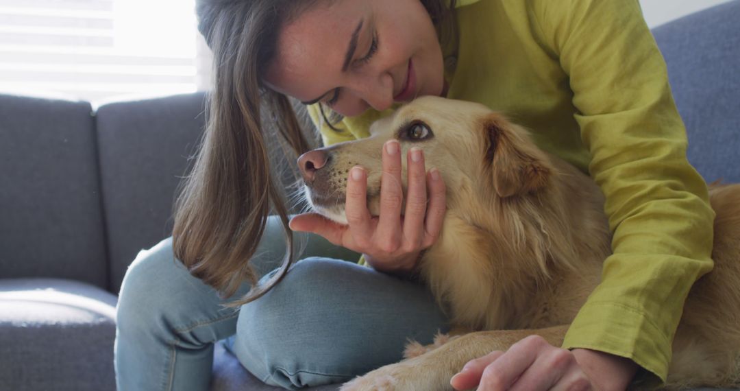 Woman Showing Affection to Pet Dog in Cozy Living Room - Free Images, Stock Photos and Pictures on Pikwizard.com