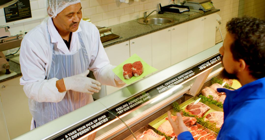 Butcher Serving Customer in Modern Meat Shop - Free Images, Stock Photos and Pictures on Pikwizard.com