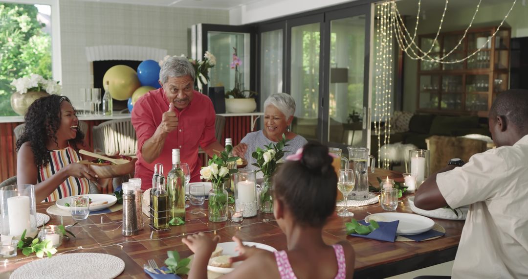 Multigenerational Family Enjoying Dinner Around Wooden Table with Candles Flowers and Laughter