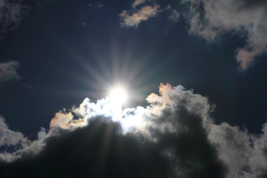 Low Angle View of Sun Shining Through Clouds - Free Images, Stock Photos and Pictures on Pikwizard.com