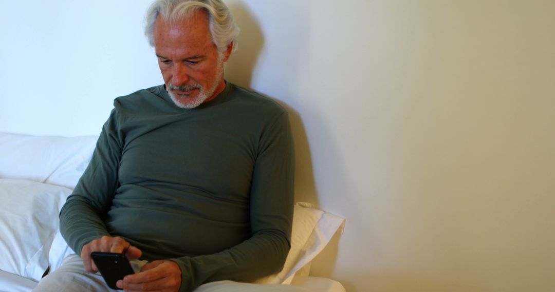 Elderly Man Using Smartphone to Stay Connected - Free Images, Stock Photos and Pictures on Pikwizard.com