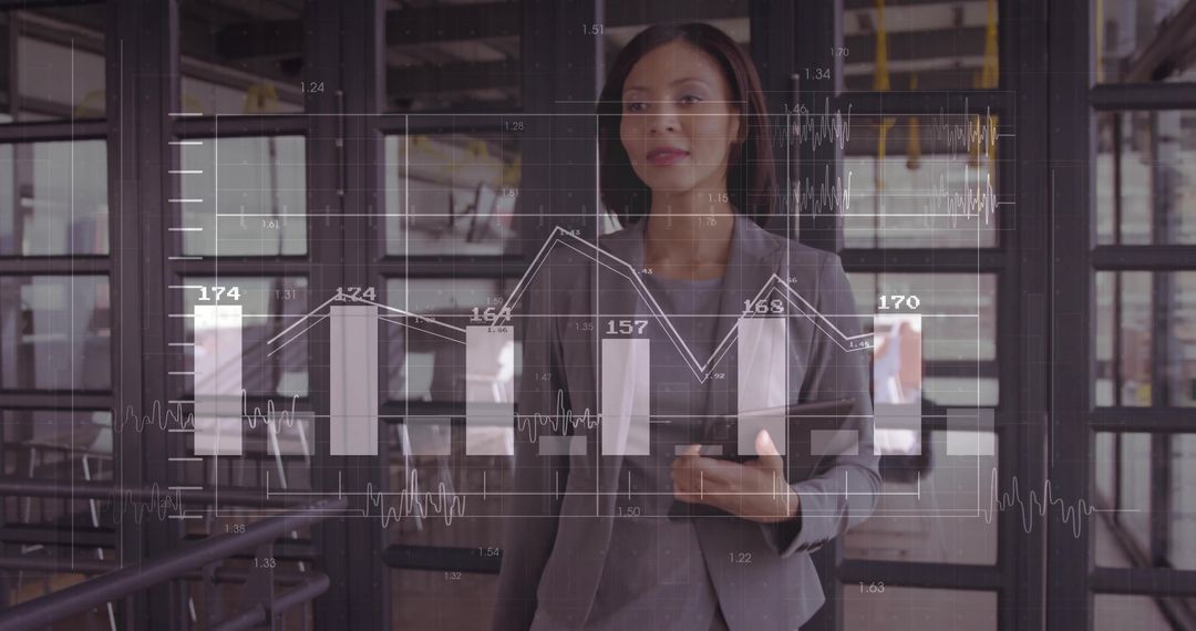 Business Executive Analyzing Digital Bar Graphs on Screen