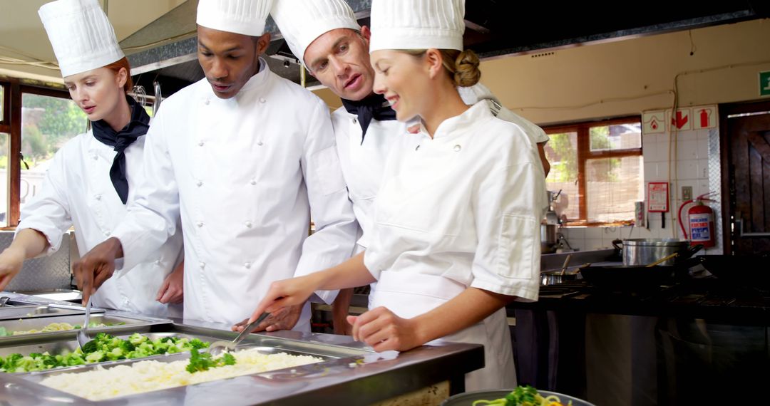 Team of Chefs Preparing Meals in Industrial Kitchen - Free Images, Stock Photos and Pictures on Pikwizard.com