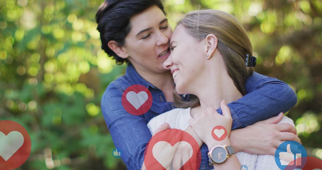Loving Female Couple Embracing Outdoors Surrounded by Digital Love Icons