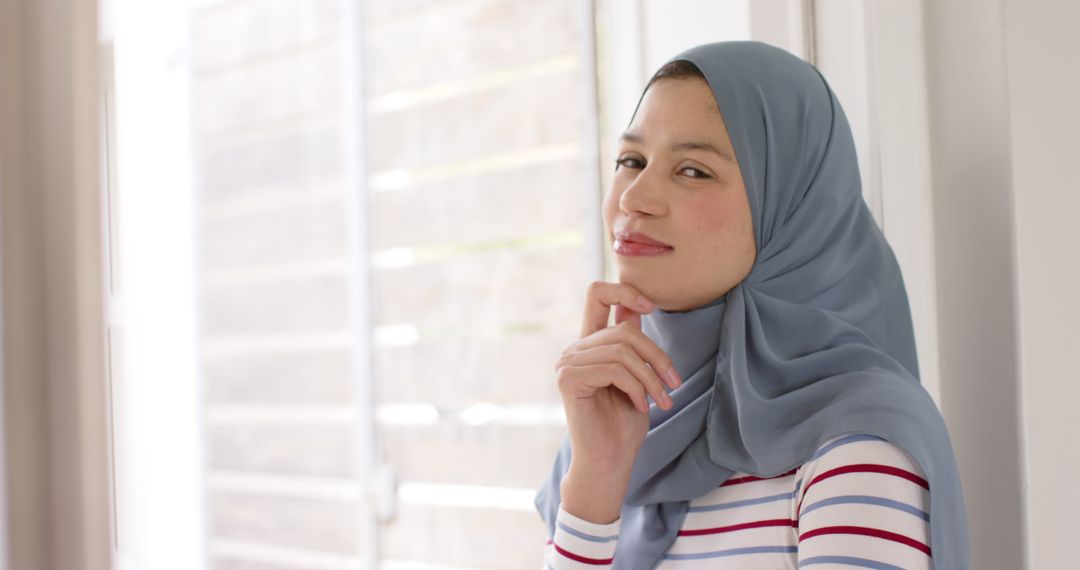 Smiling Biracial Woman Wearing Hijab Indoors - Free Images, Stock Photos and Pictures on Pikwizard.com