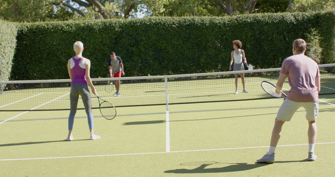 Diverse Group Playing Tennis on Outdoor Court - Free Images, Stock Photos and Pictures on Pikwizard.com