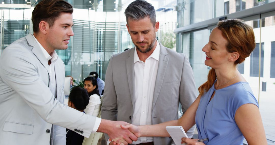 Business Meeting Handshake and Interaction in Modern Office