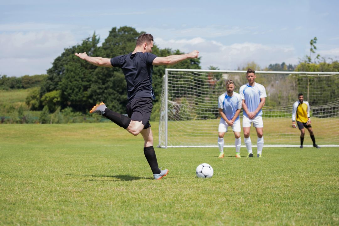 Football player taking a penalty shot - Free Images, Stock Photos and Pictures on Pikwizard.com