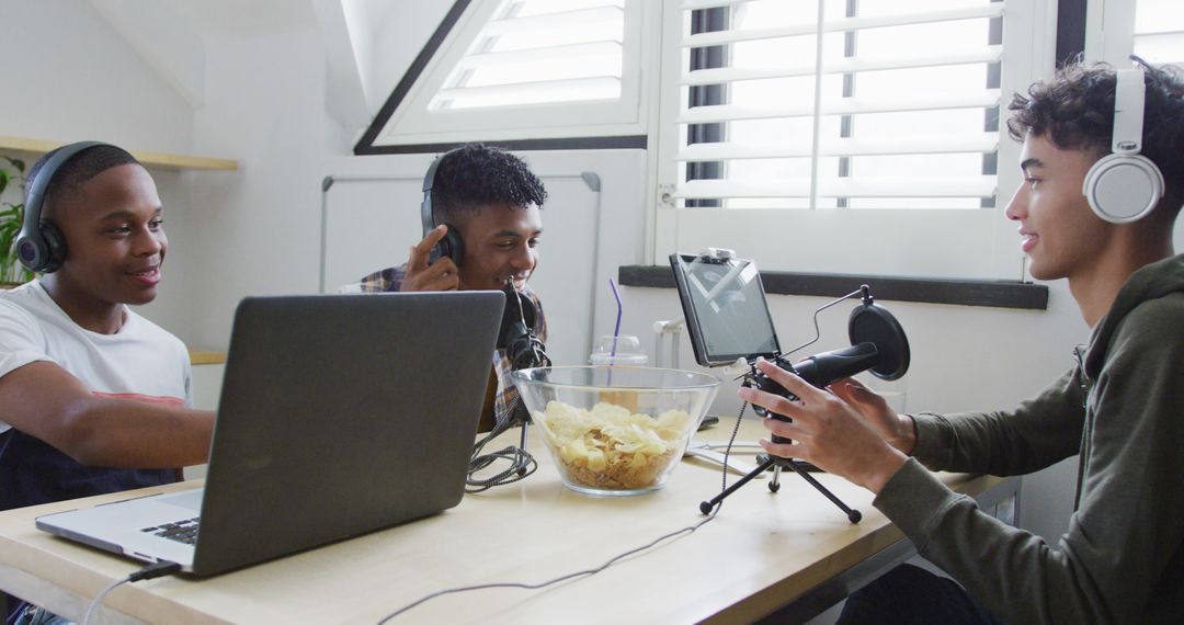 Teenagers Hosting a Podcast, Engaging Discussion with Laptops and Microphones - Free Images, Stock Photos and Pictures on Pikwizard.com