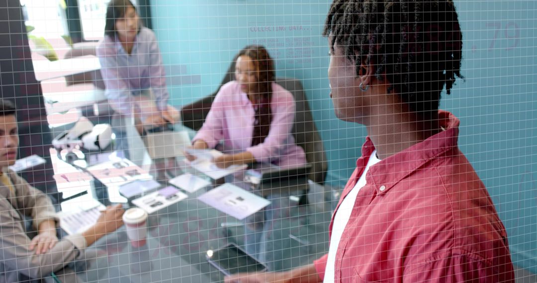 Addressing Team During Creative Meeting, Male Presenter Holding Tablet at Conference Table