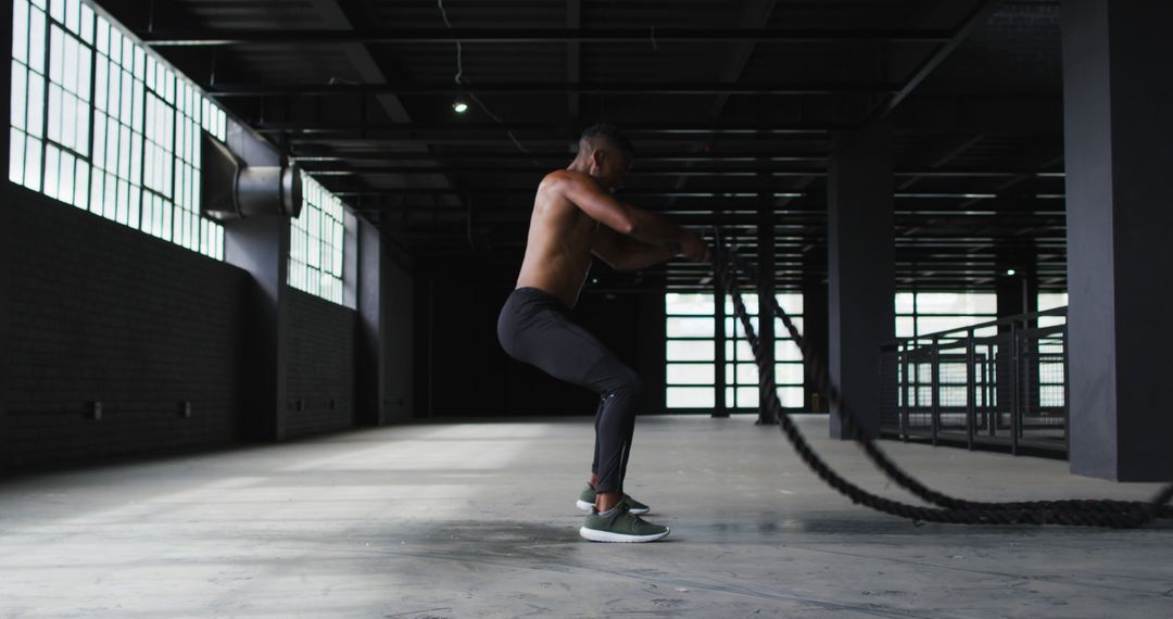 Shirtless Man Training with Battle Ropes in Gym - Free Images, Stock Photos and Pictures on Pikwizard.com