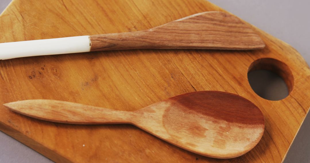 Handcrafted Wooden Kitchen Utensils on Rustic Cutting Board - Free Images, Stock Photos and Pictures on Pikwizard.com