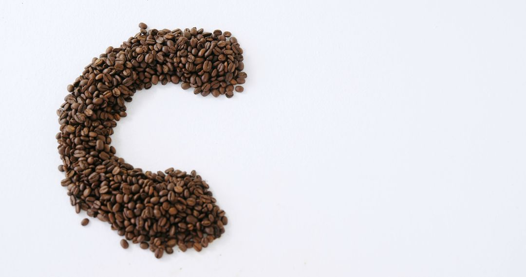 Roasted Coffee Beans Forming Letter C on White Background - Free Images, Stock Photos and Pictures on Pikwizard.com