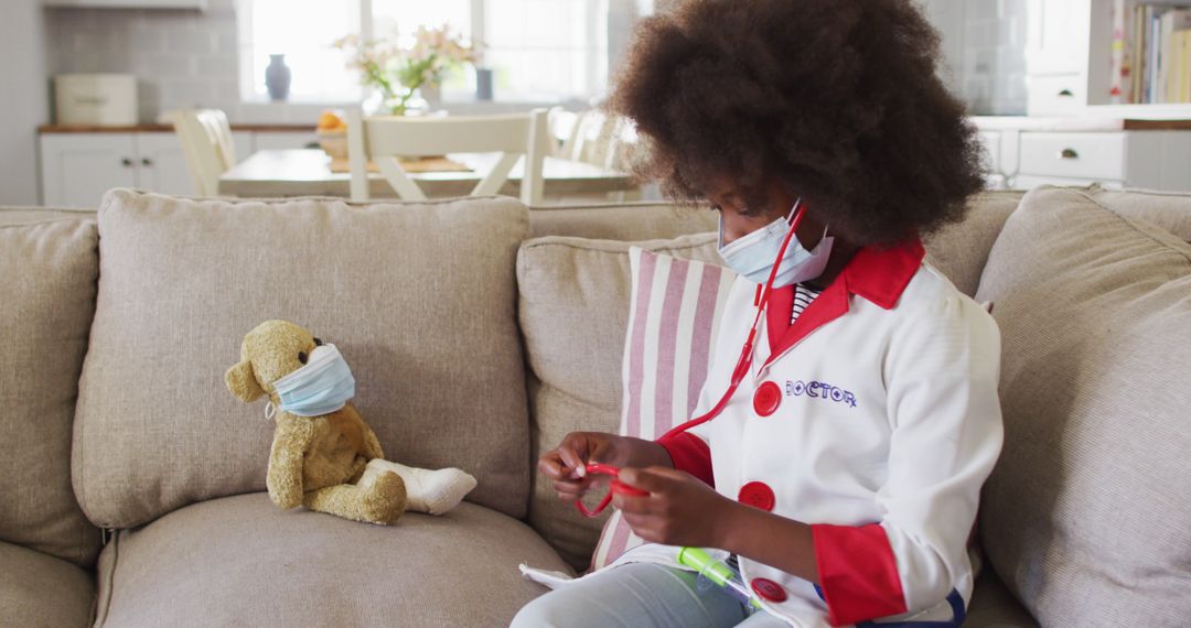 African American Girl Playing Doctor with Teddy Bear at Home - Free Images, Stock Photos and Pictures on Pikwizard.com