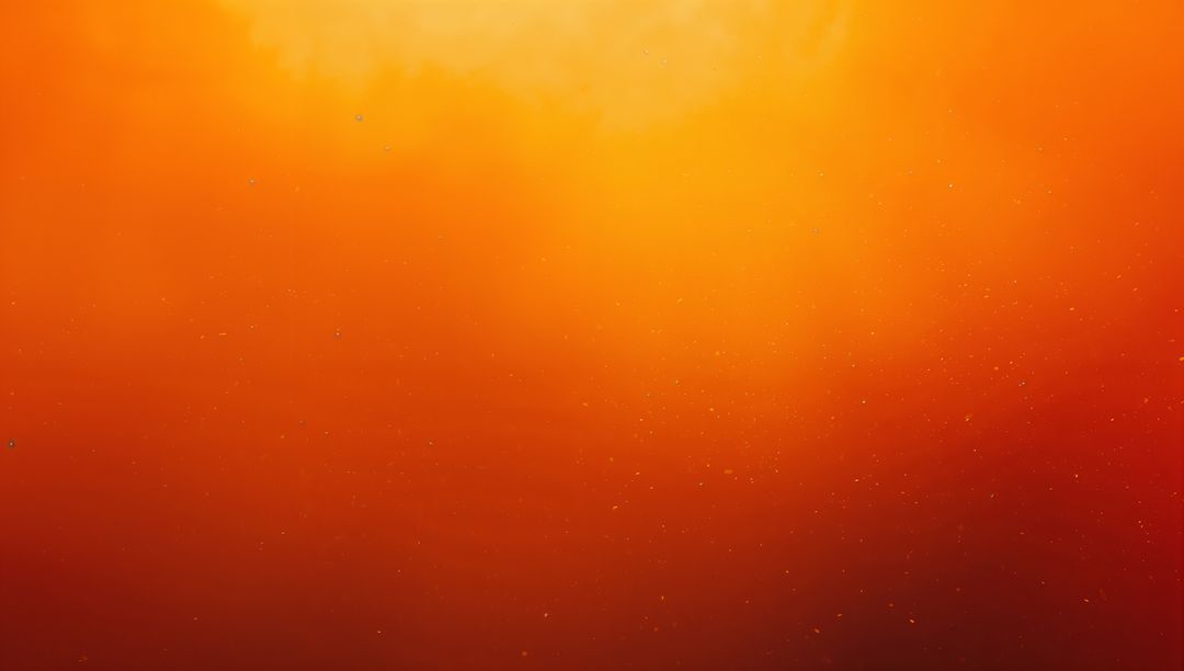 Vibrant Orange Gradient Background with Sparkling Texture