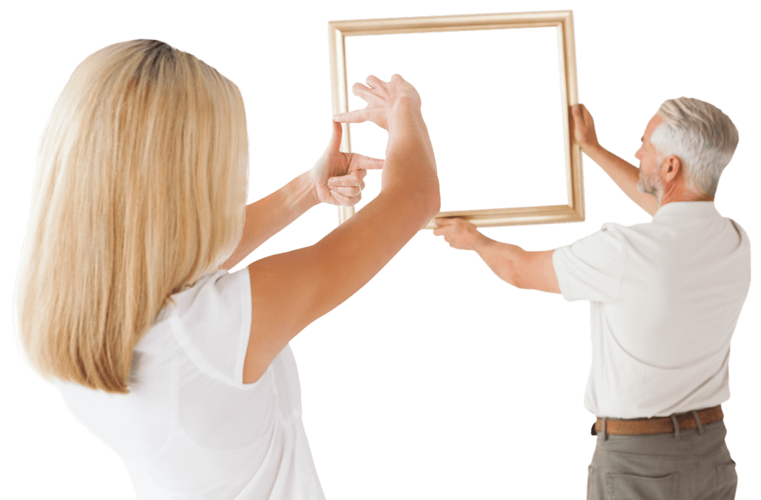 Transparent Happy Couple Hanging an Empty Wooden Frame