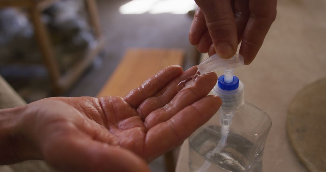 Using Hand Sanitizer with Pump Bottle for Maintaining Clean Hands - Free Images, Stock Photos and Pictures on Pikwizard.com