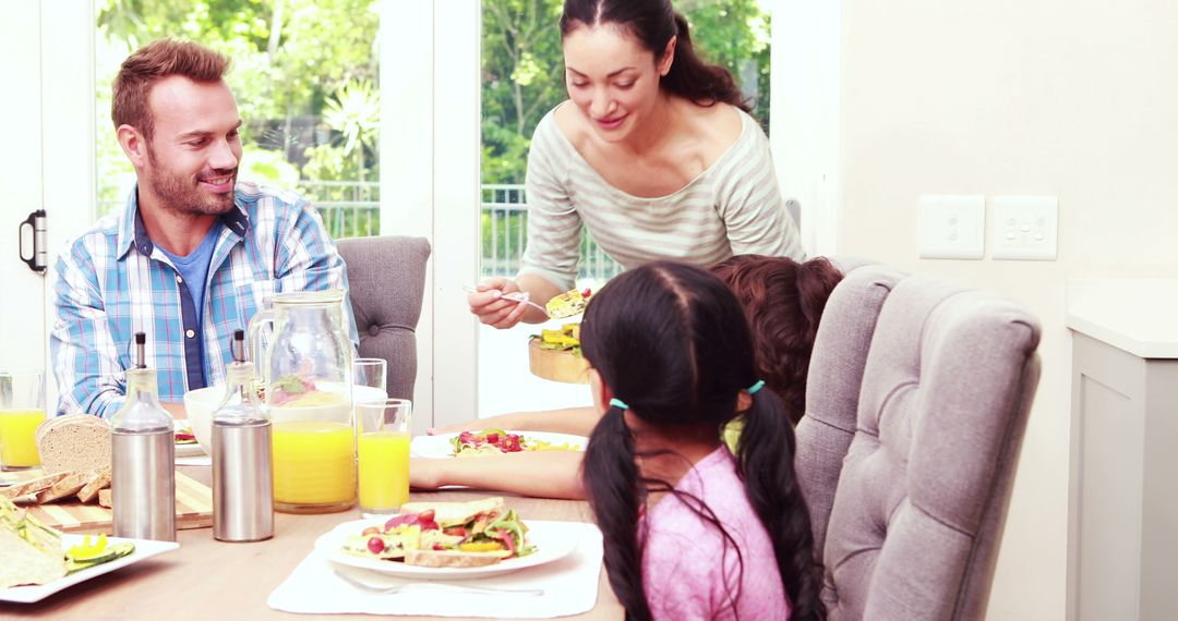 Mixed Ethnicity Family Enjoying Breakfast Together - Free Images, Stock Photos and Pictures on Pikwizard.com