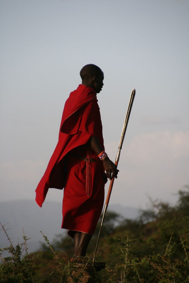 Maasai Warrior in Traditional Red Robe Holding Spear - Free Images, Stock Photos and Pictures on Pikwizard.com