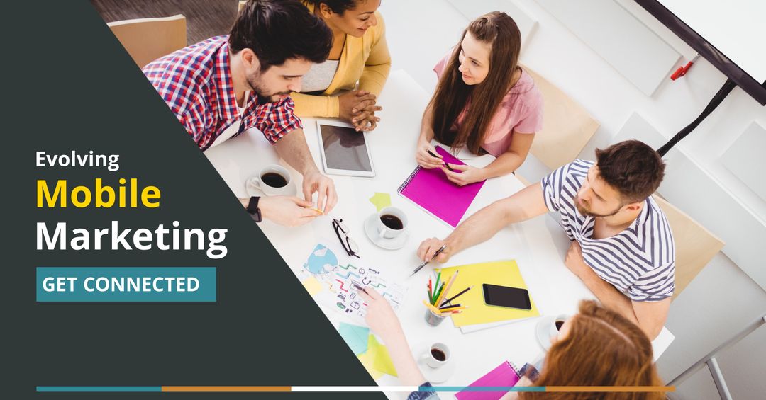 Diverse Team Collaborating on Mobile Marketing Strategies