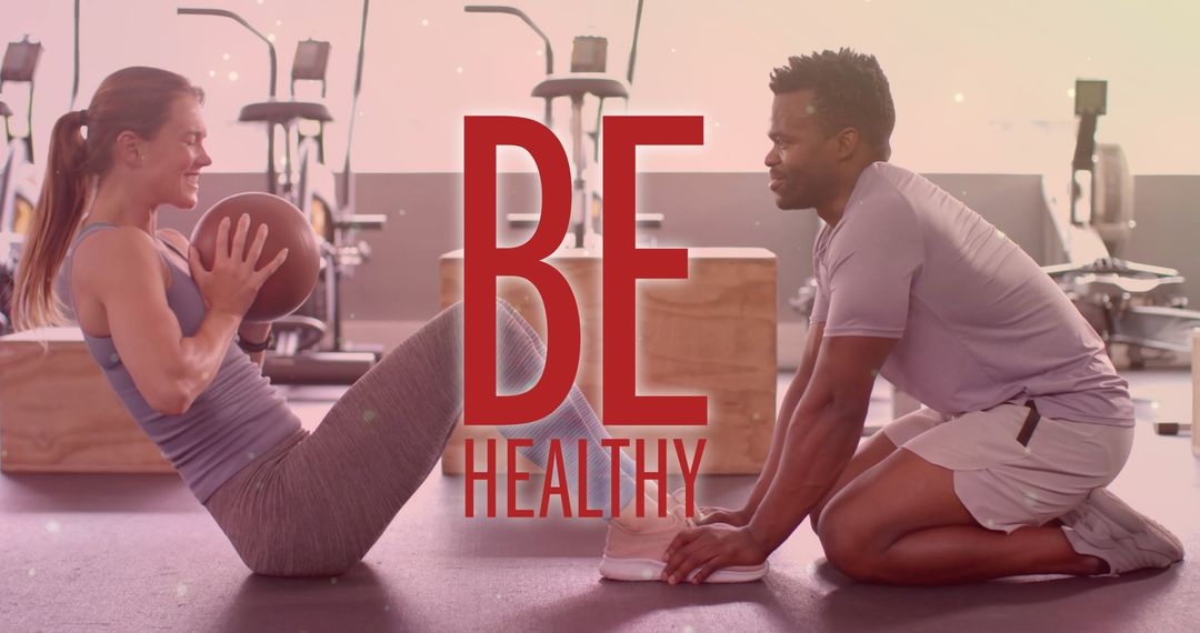 Diverse Duo Exercising in Modern Gym Setting
