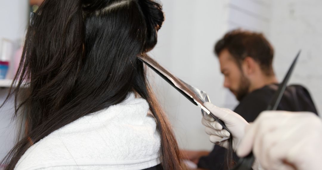 Hairdresser Applying Hair Color on Female Client - Free Images, Stock Photos and Pictures on Pikwizard.com