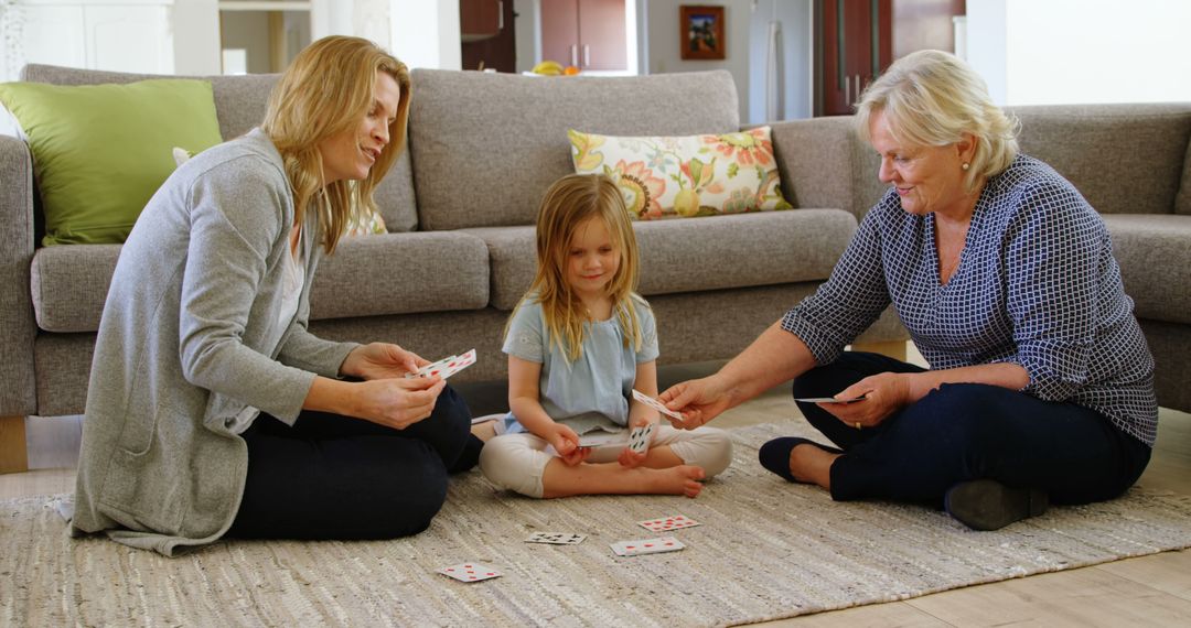 Three Generations Playing Cards on Living Room Floor - Free Images, Stock Photos and Pictures on Pikwizard.com