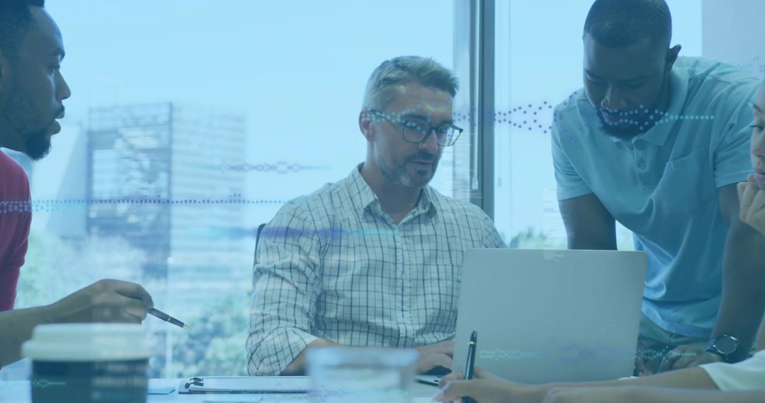 Diverse Business Team Collaborating in Modern Office Focused on Project