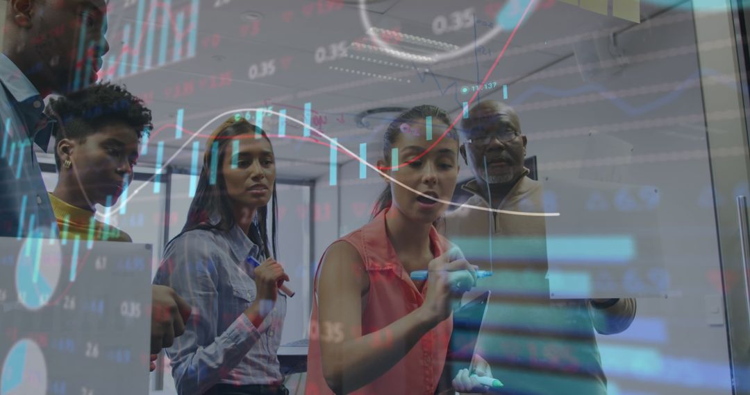 Diverse Business Team Analyzing Financial Graphs and Data Projections