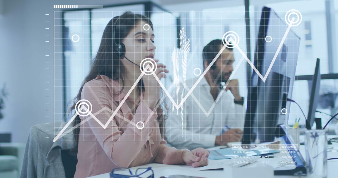 Business Team Analyzing Data on Multiple Monitors