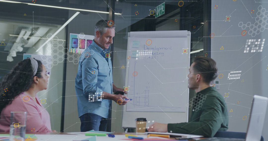 Team Analyzing Development Charts During Corporate Meeting