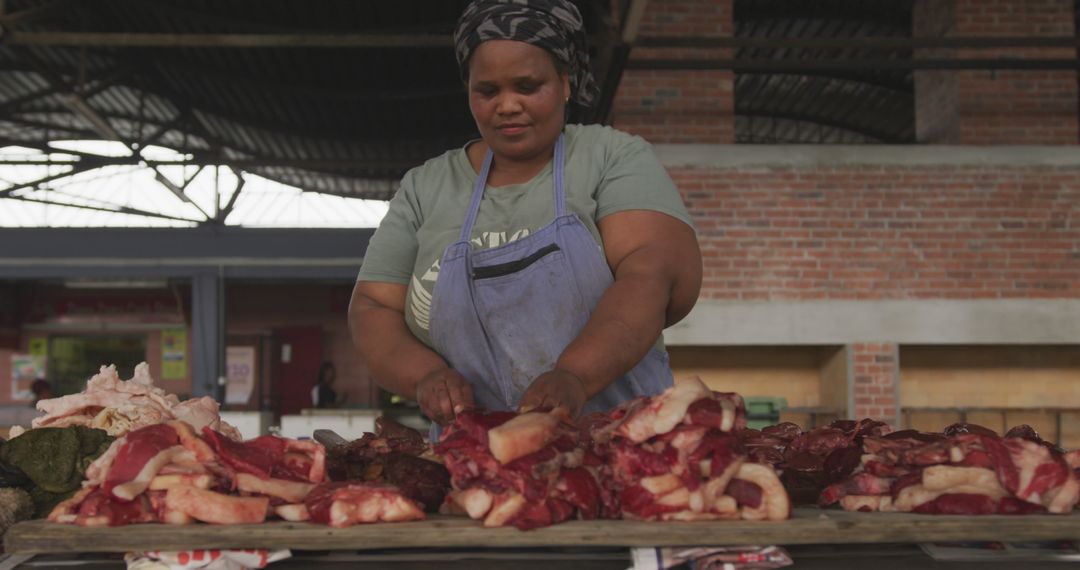 Female Butcher Preparing Meat in Outdoor Market - Free Images, Stock Photos and Pictures on Pikwizard.com